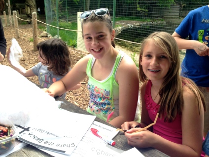 Helia Silveira and Ellie O'Donnell work on the piping plover chick craft. Credit: USFWS