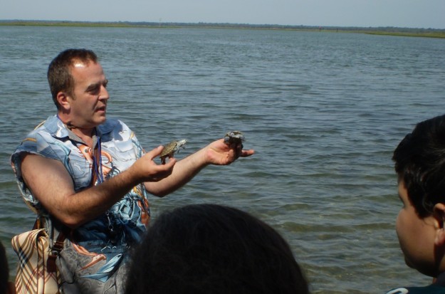 Doug Beckert doing environmental education with visitors at the refuge. Credit: USFWS