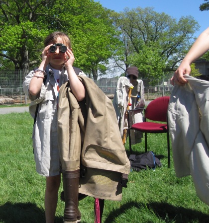 Aracelys Velazquez tries out binoculars at the Endangered Species Day event booth. Credit: USFWS
