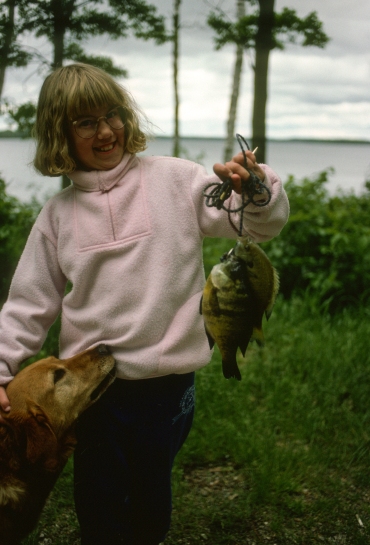 Daughter Emily with some big sunfish caught while camping in Minnesota in 1993