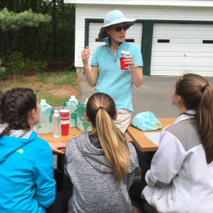 Amoskeag Fishway educator teaching 7th graders about watersheds and water quality.